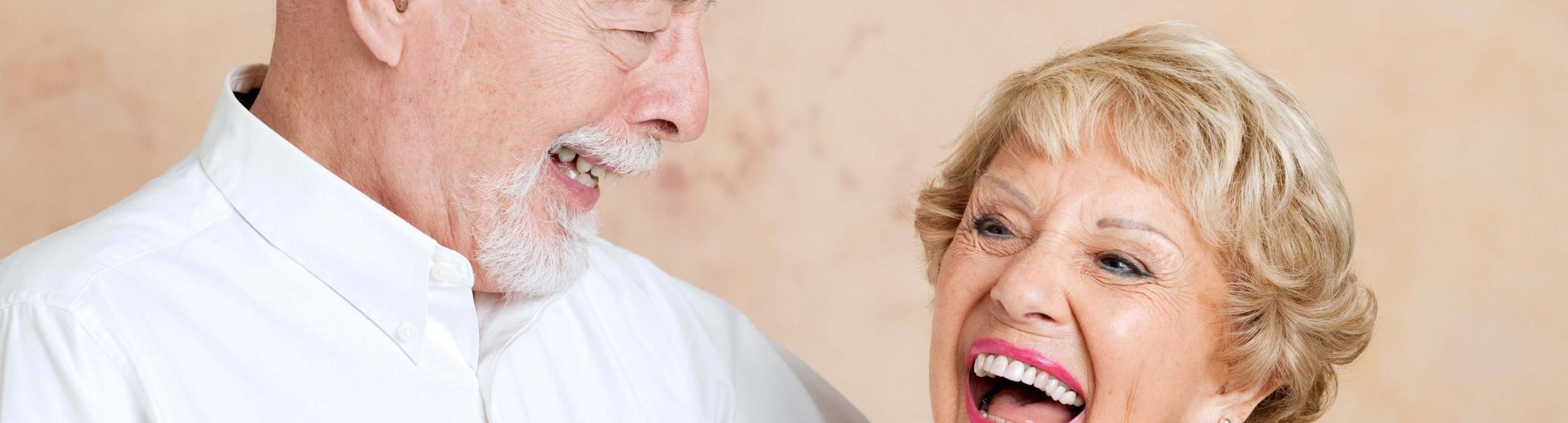 Two people laughing together.