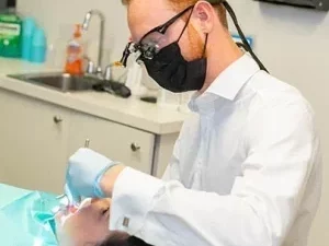 Dentist doing work on patient's mouth.